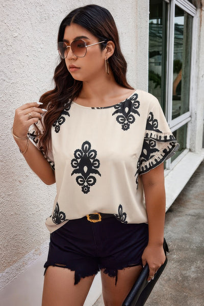 Plus size beige printed blouse with wide round neckline and ruffle hem