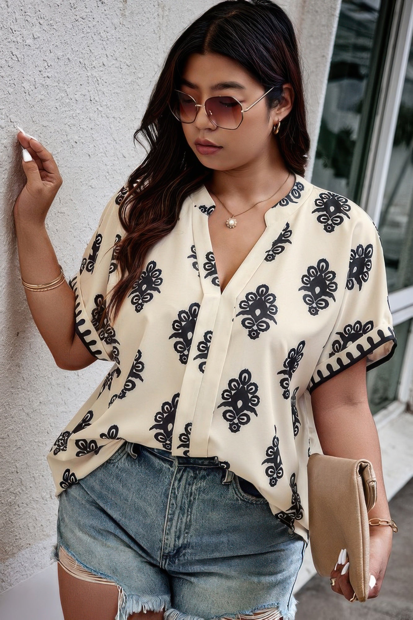 Plus size beige printed short sleeve blouse with V-neck and relaxed fit