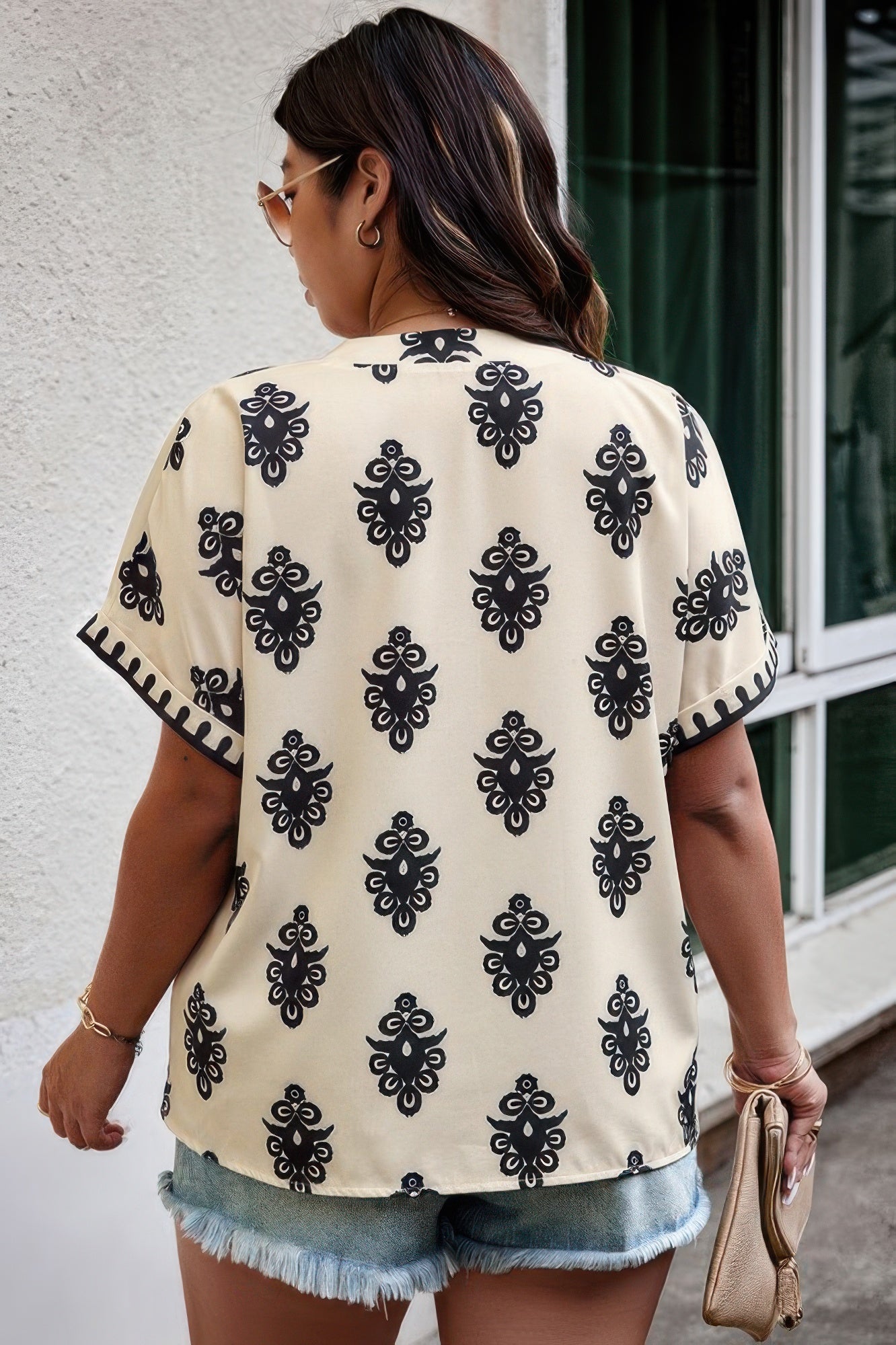 Plus size beige printed short sleeve blouse with V-neck and relaxed fit