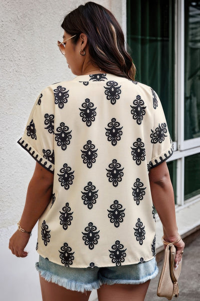 Plus size beige printed short sleeve blouse with V-neck and relaxed fit